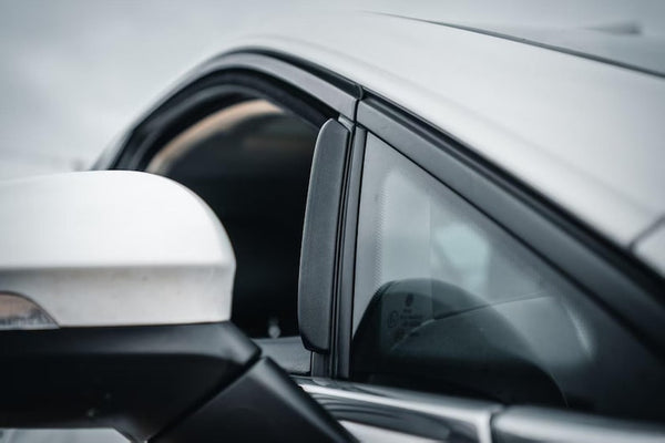 Mirror wind deflector on silver VW Golf